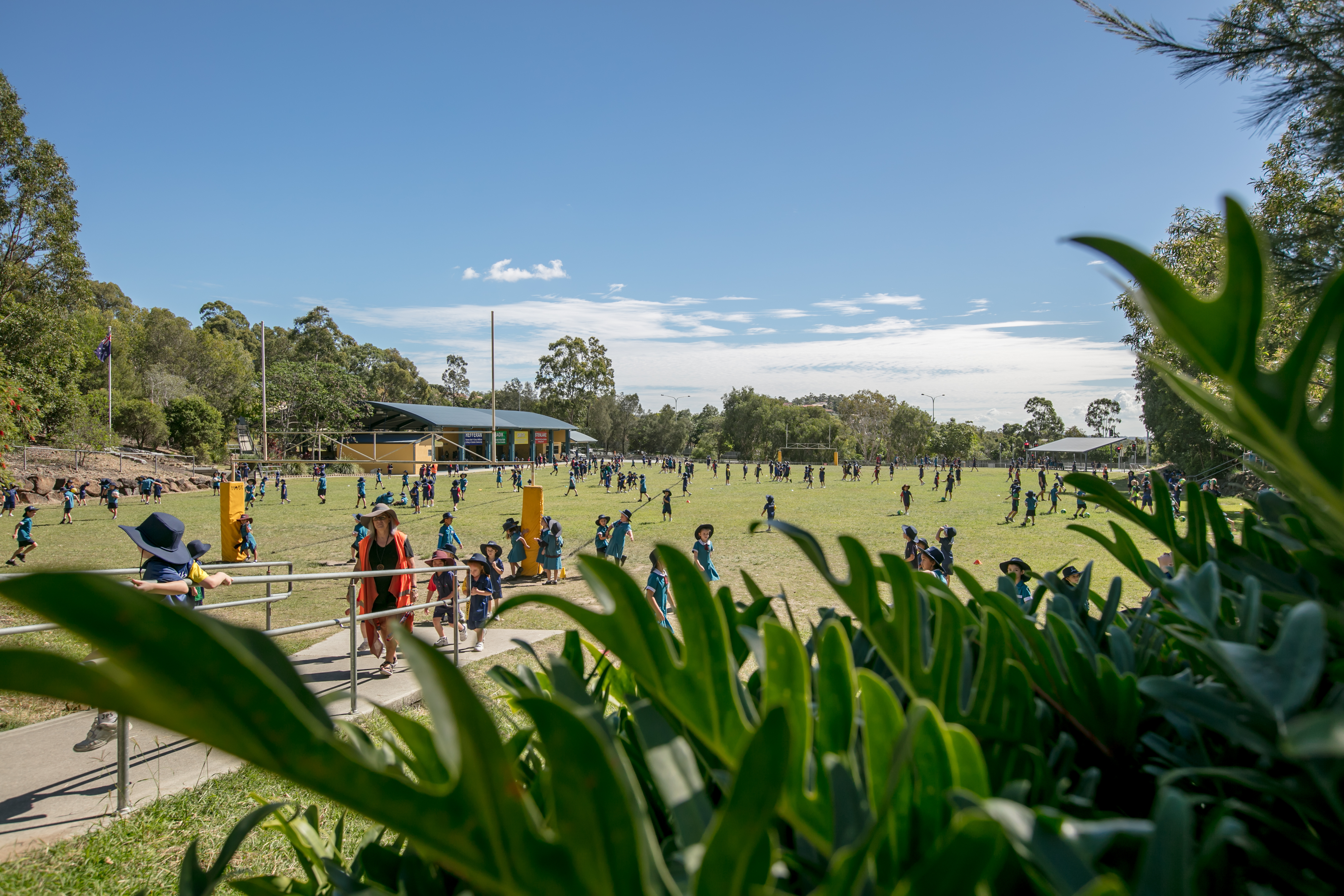landscape view of oval with children playing